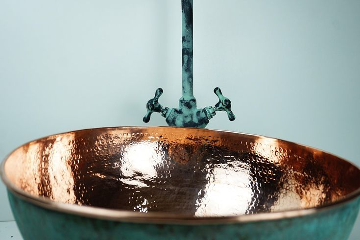 Antique Brass Bathroom Faucet with Gooseneck Spout and Luxurious Patina