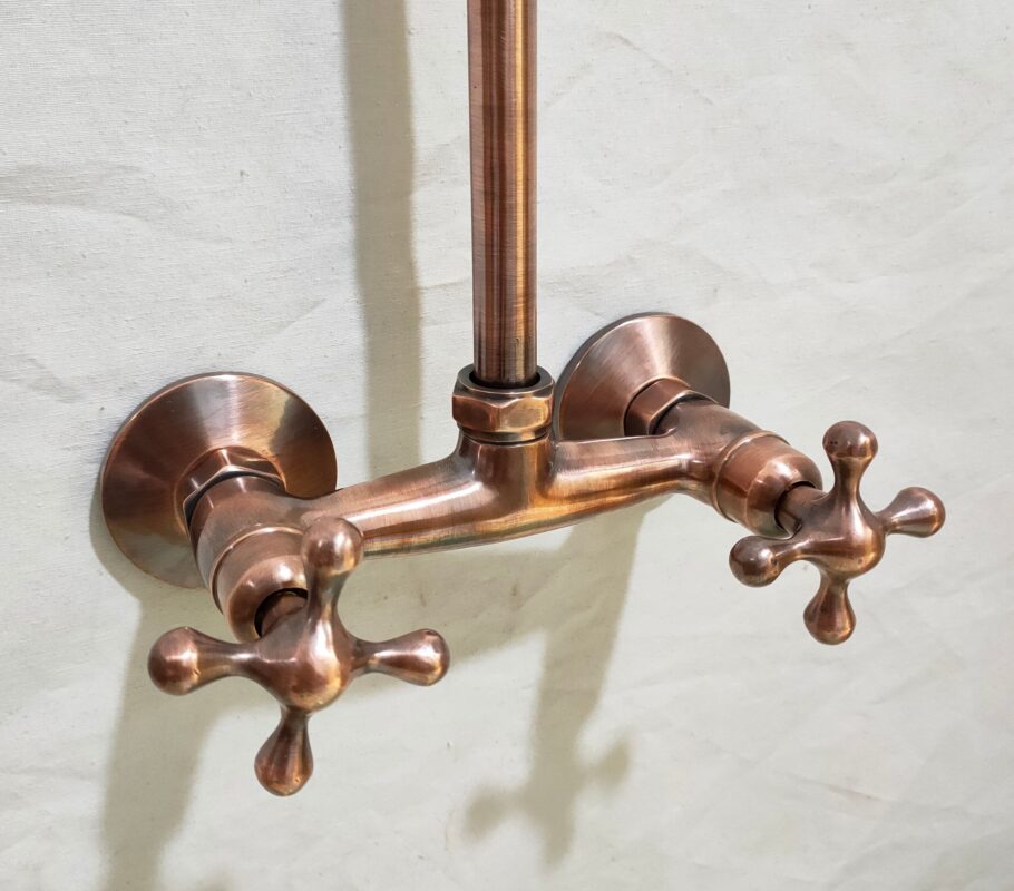 Copper indoor and outdoor shower system featuring high pressure.