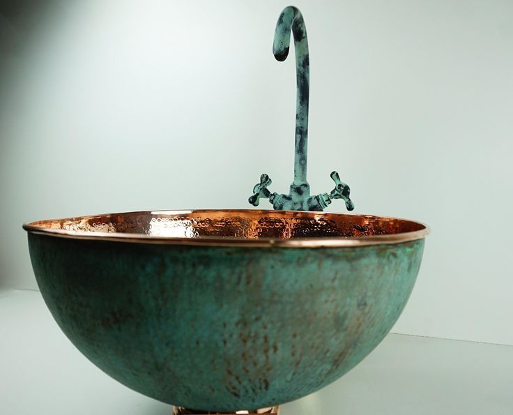Vintage Romance: Antique Brass Bathroom Faucet with Gooseneck Spout and Luxurious Patina