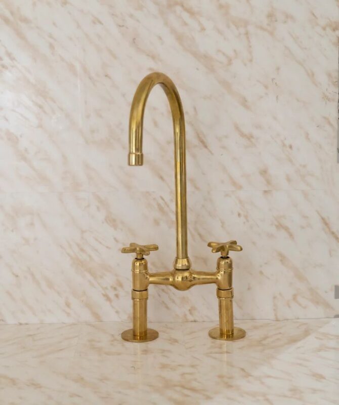 A Timeless Classic: The Unlacquered Brass Bridge Kitchen Faucet with Ball Center