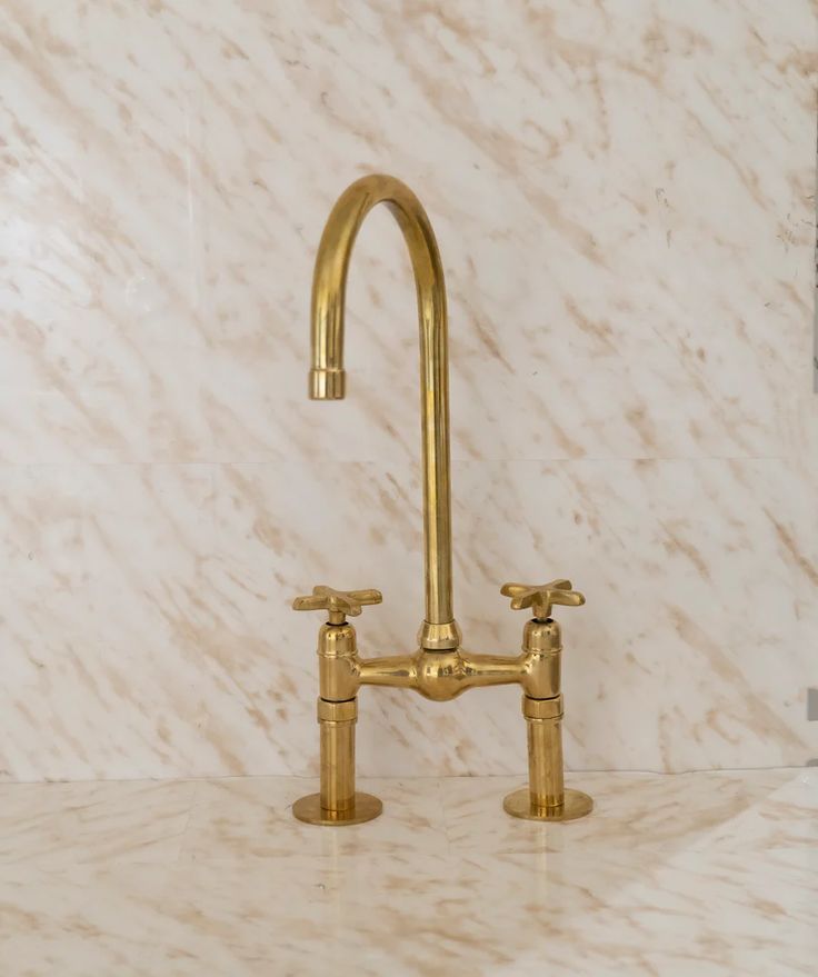 A Timeless Classic: The Unlacquered Brass Bridge Kitchen Faucet with Ball Center