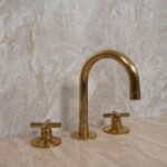 A Timeless Classic: The Widespread Unlacquered Brass Bathroom Faucet