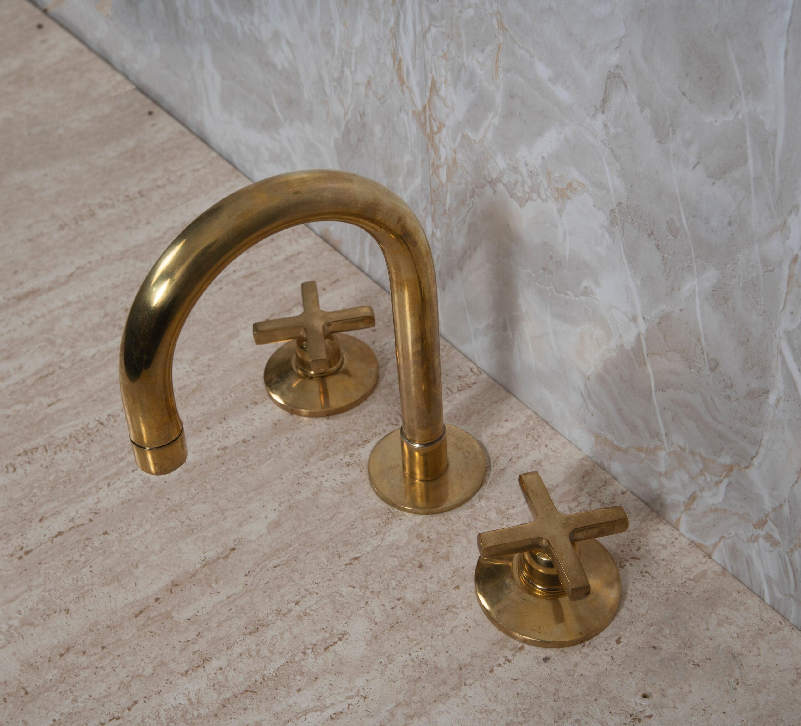 Bring the Industrial Look to Your Bathroom with This Widespread Unlacquered Brass Faucet
