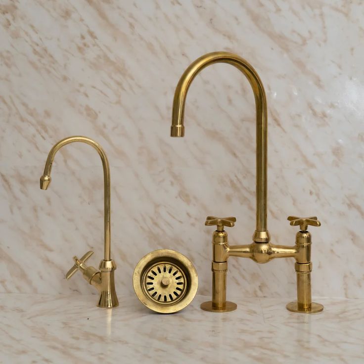 Sleek and Sophisticated: The Unlacquered Brass Bridge Kitchen Faucet with Ball Center