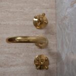 Widespread Unlacquered Brass Bathroom Faucet: A Touch of Industrial Elegance